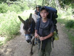 Leading a burro from Pueblano to Ponil